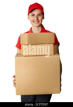 delivery woman in red uniform holding cardboard packages in front. isolated on white background Stock Photo