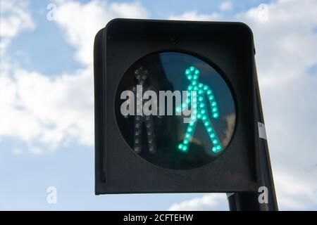 Green light on a pedestrian traffic light. Safe crossing of the road by ...