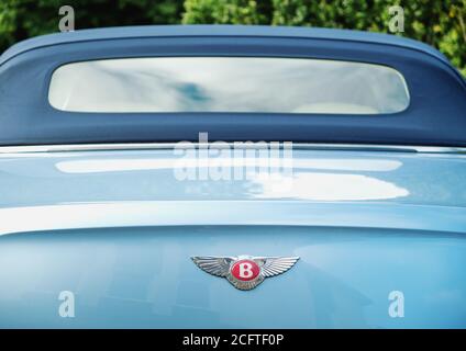 Close up of blue Bentley luxury car from behind with logo emblem Stock Photo