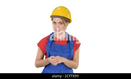 Construction female worket explaining her ideas to camera on white background. Stock Photo