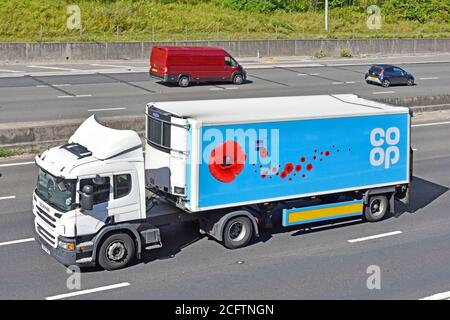 Coop co op food supply chain Scania store delivery lorry truck & short trailer red poppy graphic supporting Royal British Legion charity UK motorway Stock Photo