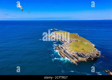 Aerial view of island Baleal naer Peniche on the shore of the ocean in west coast of Portugal. Baleal Portugal with incredible beach and surfers. Aeri Stock Photo