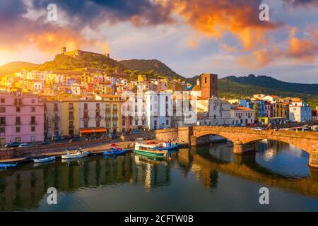 Aerial view of the beautiful village of Bosa with colored houses and a medieval castle. Bosa is located in the north-wesh of Sardinia, Italy. Aerial v Stock Photo