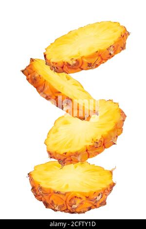falling pineapple slices isolated on white background with full depth of field Stock Photo