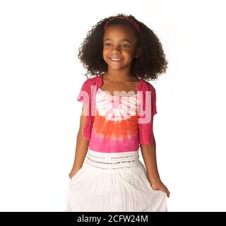 Smiling happy little girl with beautiful curly frizzy hair Stock Photo