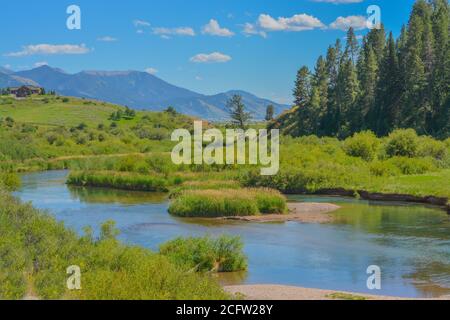 The peaceful flowing of the Snake River in the Rocky Mountains of Wyoming Stock Photo