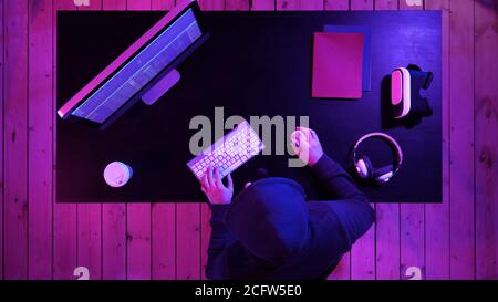Software developer computer at dark home office. Startup and hard working concept. Stock Photo
