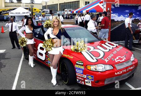 Cheerleaders from the Budweiser Racing Team greet family and friends during  the arrival of Nimitz Class