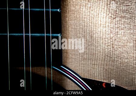 Abstract composition of spruce top 12 string guitar and fingerboard Stock Photo