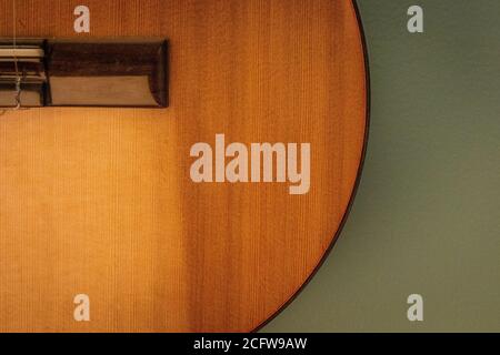 Abstract composition of cedar top classical guitar body and bridge Stock Photo