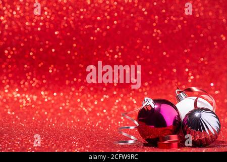 Background Christmas ball on red glitter background Stock Photo