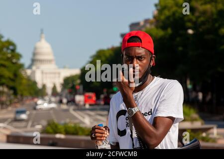 Washington, DC, USA, September 7, 2020. Pictured: Ty Hobson-Powell, founder and director of policy of Concerned Citizens of DC, concluded Let Freedom Sing with an appeal to all to vote. Let Freedom Sing was a community-building protest and voter registration event by the Freedom Day Foundation and Head Count. Credit: Allison C Bailey/Alamy Credit: Allison Bailey/Alamy Live News Stock Photo