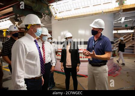KENNEDY SPACE CENTER, FL, USA - 27 July 2020 - NASA Administrator Jim Bridenstine (left), accompanied by Jacobs and Exploration Ground Systems employe Stock Photo