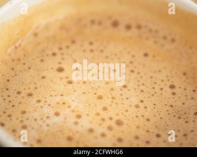Texture of coffee foam. Close-up top-down view Stock Photo