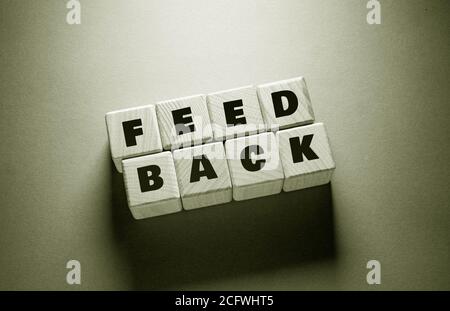 Feed Back Word Written on Wooden Cubes Stock Photo