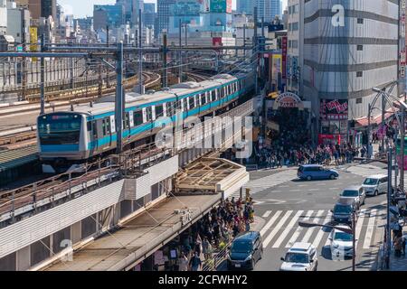 Train arriving at a station in Tokyo, Japan Stock Photo