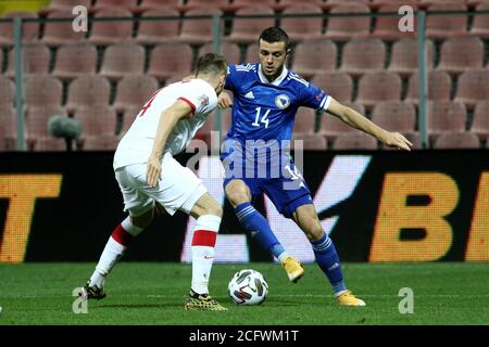 Zenica, Bosnia and Herzegovina. 7th Sep, 2020. Armin Hodzic (R) of Bosnia and Herzegovina (BiH) vies with Tomasz Kedziora (1st L) of Poland during the UEFA Nations League football match between BiH and Poland in Zenica, Bosnia and Herzegovina, on Sept. 7, 2020. Credit: Nedim Grabovica/Xinhua/Alamy Live News Stock Photo