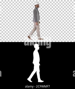 Architect in white helmet walking, Alpha Channel Stock Photo