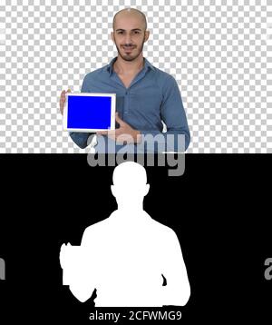 Smiling casual man presenting a tablet with a blank screen, Alpha Channel Stock Photo