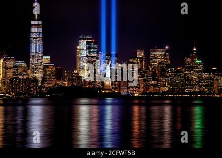 9/11 Memorial Beams with Statue of Liberty and Lower Manhattan. Stock Photo