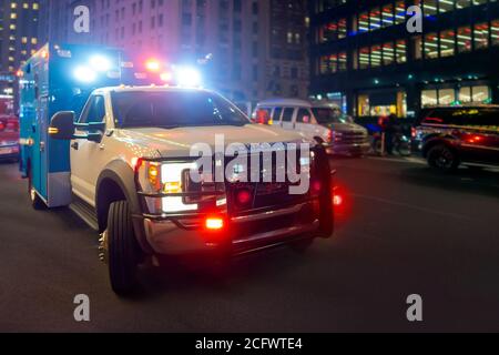 Night ambulance with lights flashing on a new york city street Stock Photo