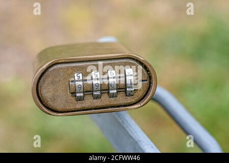 Old Padlock attached to a grey handle with the combination 1066, Denmark, June 8, 2020 Stock Photo
