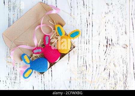 Cute creative photo with eggs as the Easter Bunny on a wooden background. Stock Photo