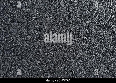 A new dark grey asphalt pavement texture. Stock Photo