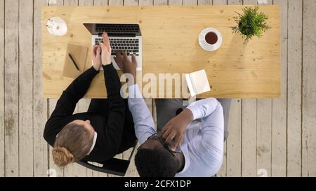 Businesswoman Using Laptop And Businessman Making Call Team work Stock Photo