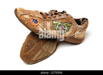 Old sport shoes isolated on white Stock Photo
