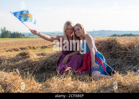 Two bavarian friends with the flag having fun Stock Photo