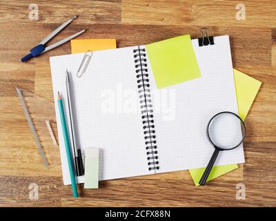 Blank notebook with supplies on white Stock Photo