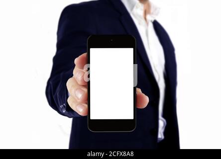 Man in suit holding blank smartphone Stock Photo