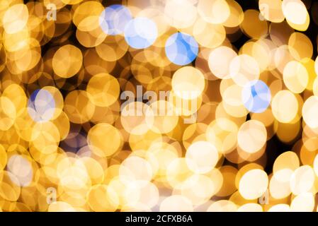 Defocused abstract golden bokeh lights background. Holidays concept. Stock Photo