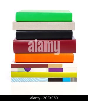 Multi-colored stack of books, white background Stock Photo