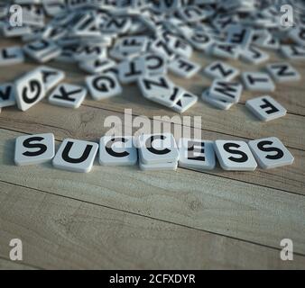 3D rendering of the word success writen in letter tiles Stock Photo