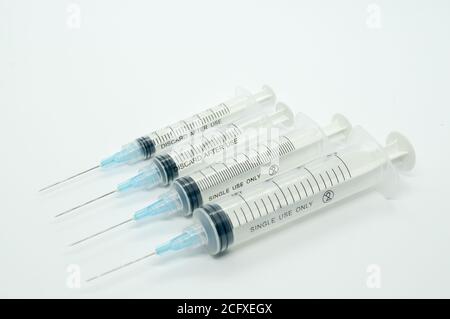 Closeup shot of different size syringes Stock Photo