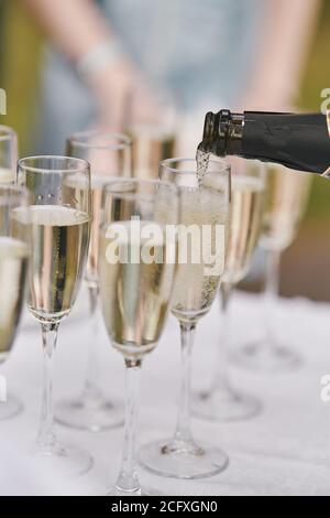 Glasses of champagne at the event. Champagne in glasses on a holiday close up Stock Photo