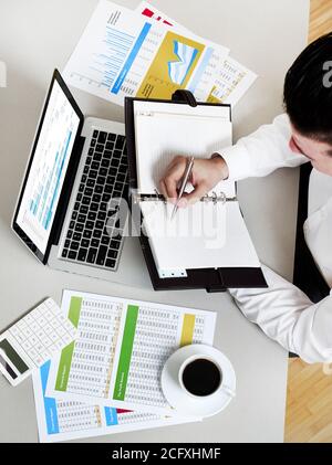 Businessman taking notes Stock Photo