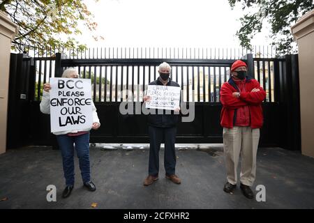 Residents protest outside the Chinese Consulate, Belfast, amid a dispute over the construction of a boundary wall and entrance gate which have been built without planning permission. Stock Photo