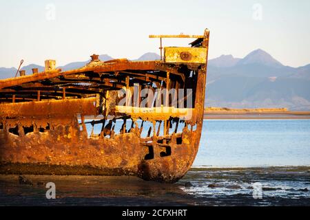 Wreck of the Janie Seddon, built in 1901, on the beach at Motueka, Nelson, South Island, New Zealand Stock Photo