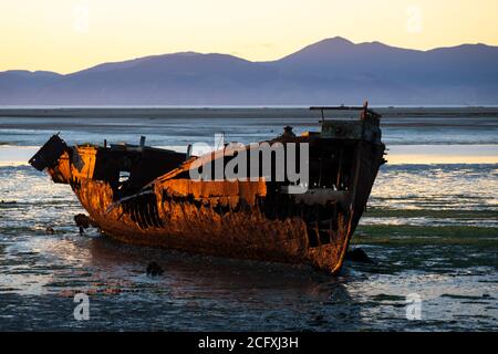 Wreck of the Janie Seddon, built in 1901, on the beach at Motueka, Nelson, South Island, New Zealand Stock Photo