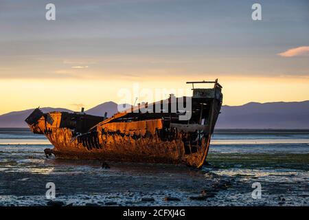 Wreck of the Janie Seddon, built in 1901, on the beach at Motueka, Nelson, South Island, New Zealand Stock Photo