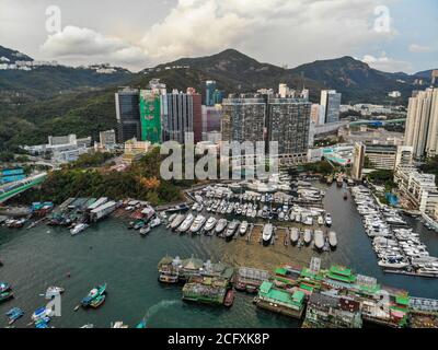 An aerial photograph taken above the Aberdeen Typhoon Shelter, showing Aberdeen Marina and apartment blocks and offices in Wong Chuk Hang, Hong Kong. Stock Photo