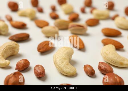 Different tasty nuts on white background. Vitamin food Stock Photo