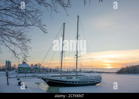 Sailing boat at a icy port in Finland Stock Photo