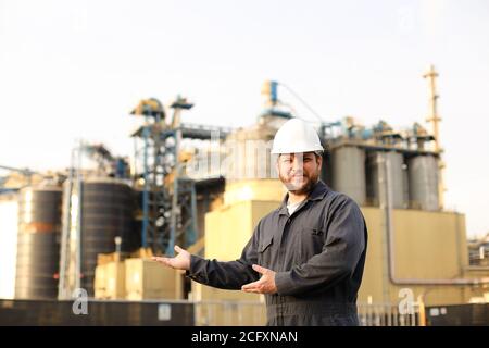 Portrait of industrial director and engineer showing factory exterior outdoors. Stock Photo