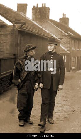 Circa 1910 - A British 'Bobby' (policeman), handcuffed to the man he has just arrested.British home minister, Sir Robert Peel (1778-1850), created London’s first organised police force. Before Peel’s 1829 reforms, public order had been maintained by  night watchmen, local constables and red  coated army soldiers. The new officers became known as Bobbies or Peelers in reference to Robert Peel. Today's a UK police officer has  a number of nicknames including, rozzer, bizzie, the bill,cop,copper,dibble,fuzz, (and others,sometimes more derogatory) Stock Photo