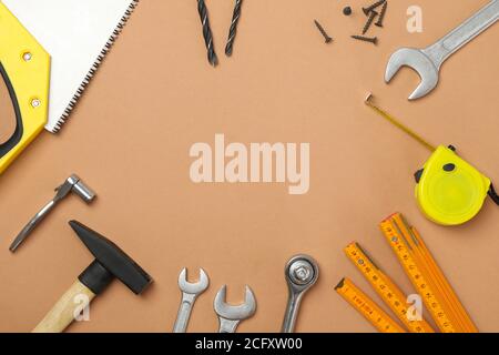 Construction tools on beige background, space for text Stock Photo