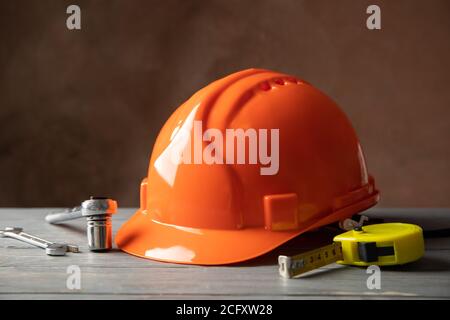 Different construction tools on white wooden table Stock Photo